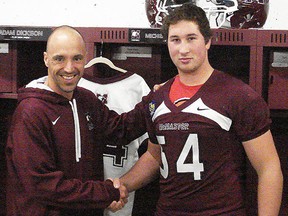 McMaster Marauders head coach Stefan Ptaszek (left) welcomes Campbellford's Michael Brouwers to his football team during a signing ceremony last week.