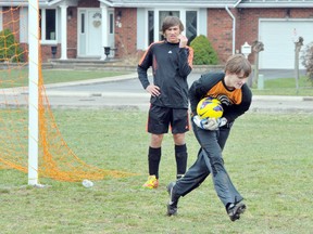 EDDIE CHAU Simcoe Reformer
Brian Gilbert, goaltender for the Waterford District High School senior boys soccer team, makes a last second catch during a practice Tuesday. The Wolves are hopeful for a chance for a championship this season.