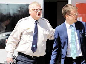 Rondeau Provincial Park superintendent Richard Post, left, exits the Chatham-Kent courthouse with his attorney, Fredrick Schumann. (Daily News file photo)