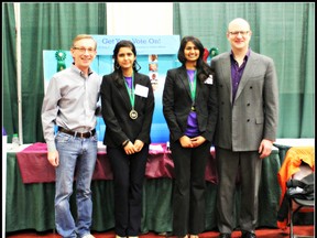 Westwood students Ashlesha Desphande and Heli Patel pose with MLAs Mike Allen and Don Scott. The students are going on the road with their project Get Your Vote On, which they will present at the Canada Wide Science Fair, May 11 to 18 in Lethbridge. SUPPLIED PHOTO