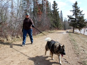 Danna Viel and her son’s Norwegian Elkhound Odin take advantage of the nice weather Wednesday afternoon by going for a walk in Beacon Hill. All Fort McMurray residents and their furry friends are encouraged to join the Fort McMurray SPCA’s Walk to Stop Animal Abuse Sunday at 10 a.m. in Thicket Park. JORDAN THOMPSON/TODAY STAFF