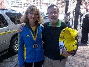 Marathoner Linda Jones, a retired educator, and supportive dentist
husband Don Munro from London, Ont., in Boston Wednesday, April 17, 2013.
(JOE WARMINGTON/QMI Agency)
