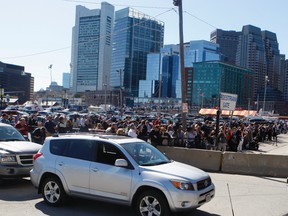 Boston's federal court was evacuated Wednesday because of a bomb threat. Media and curious onlookers were pushed back into a parking lot 50 metres from the building while it was being cleared. (CHRIS DOUCETTE/QMI Agency)