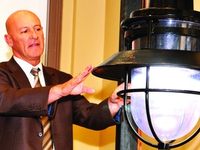 NICK GARDINER The Recorder and Times
Prescott public works director Craig Cullen shows a lighting style sample to be considered for a waterfront park during a public meeting Wednesday.