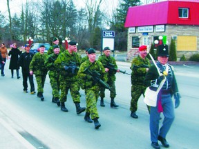 Members of the Brockville Rifles carry the colours of the 104th Regiment of Foot down Gananoque's main street, in a recreation of a march that took place in 1813, from Fredericton, N.B. to Kingston.
Wayne Lowrie/Gananoque Reporter