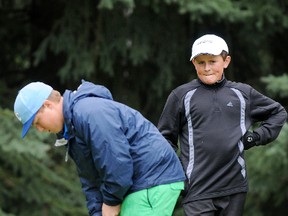 Sean Tomkins putts while Max Sekulic watches on the 10th green during the 2012 Dunes Junior Open. Tomkins and Sekulic are two promising young golfers  who will benefit from the new Peace Country Junior Tour. (TERRY FARRELL/DAILY HERALD-TRIBUNE)