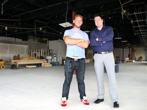 The Wood Buffalo Brewing Co. co-owner Socrates Korogonas, left, and Steve Sachse pose shortly after the brewery was announced. Management for the brewery is angry over the province's beer tax policy, which they say gives beers brewed outside Alberta an unfair advantage.