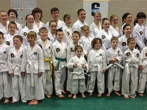 The 30 Horangi Taekwon-do School students combined for 48 medals at the Western Canadian Taekwon-Do Championships. Pictured are the students that attended the meet. Back row (from left) – Michelle Davis, Christine Nickerson, Eric Girouard, Cody Haire, Eldon Weaver, Vickie Hamel, Teevin Fournier, Tina Henderson, Nikita Lattery, Catlin Chiasson; middle row – Kahlan Nickerson, Savanah Sauntry, Kaylia Hall, Matrim Davis, Jaclynne Bos, Anna Kaufmann, Courteney Dyer; front row – Daniel Nickerson, Kaden Hiebert, Tove Whibley, Jace Davis, Aspyn Hufnagel, Seth Weaver, Ashtyn Dyer, Skylar Dyer, Levi Henderson, Nathaniel Weaver, Izaiha Monteith. (Submitted)