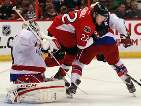 The Ottawa Senators took on the Washington Capitals at Scotiabank Place in Ottawa, Thursday April 18, 2013. Erik Condra from the Senators tries to get the puck past Capital's goalie Braden Holtby, during third period action Thursday night at Scotiabank Place.  Tony Caldwell/Ottawa Sun/QMI Agency