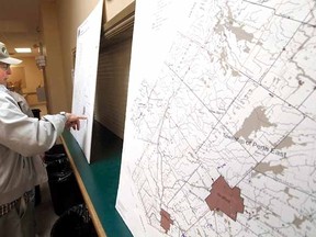Maps of Perth County were on display at the Sebringville Community Centre Thursday night as nearly 150 people turned out for a special meeting to consider possible revisions to the county's Official Plan. (MIKE BEITZ, The Beacon Herald)