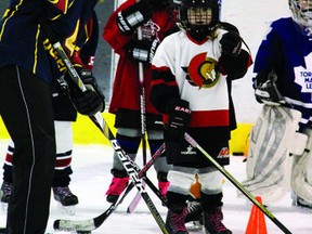 Sam Regier, who plays on the Queen’s University women’s hockey team, shouts instructions during a girls’ minor hockey clinic at the Pembroke Memorial Centre. The event was co-ordinated by Hockey Canada.