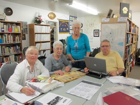 (From left) Lois Beatty, Donna Kemp, Marilyn Cross and Ted Wallace are volunteers who meet weekly to maintain records and archives for the Brant County Branch of the Ontario Genealogical Society.  It includes extensive records for Haldimand and Norfolk counties. (CAROL STEEDMAN For The Expositor)