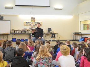 Former NHLer Nathan Dempsey read to students at St. Joseph Catholic School in Spruce Grove in celebration of Literacy Week on April 15. - Thomas Miller, Reporter/Examiner