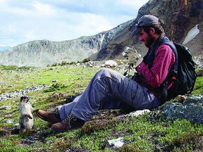 The Society for Conservation Biology is hosting a nature hike led by world-class naturalists Mark Conboy (seen here taking a photograph of a marmot) and Vanya Rohwer on Saturday, April 20.