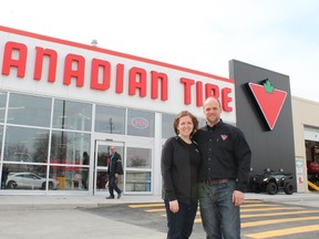 Associate dealer Karel and his wife Krista van Tol pose in front of the new Canadian Tire store in Paris, Ontarion on its opening day, Thursday, April 18, 2013. MICHAEL PEELING/The Paris Star/QMI Agency