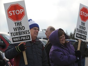 Plympton-Wyoming residents Bill Yates and Yvonne Vanderbeld picket outside Suncor's public open house held in Camlachie, Ont. Tuesday, April 2, 2013. (BARBARA SIMPSON, The Observer)