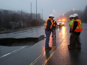 A highway near North Bay is closed after a sinkhole opened on the road before 3 a.m. Friday. (QMI Agency)
