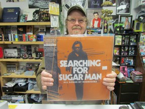 Paul Muncaster, owner of The Rad Zone, displays a vinyl copy of the Search for Sugar Man soundtrack in preparation of Independent Record Store Day, celebrated at the store Saturday.