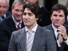 Liberal leader Justin Trudeau receives a standing ovation from his caucus during Question Period in the House of Commons on Parliament Hill in Ottawa, April 16, 2013. (REUTERS/Chris Wattie)