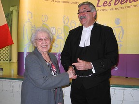 Irene Bernacka Reeve-Newson receives her 50-year Volunteer Service Award from Brant MPP Dave Levac at the 2013 ceremony held at the Petofi Hungarian Culture Club in Brantford April 18, 2103. Reeve-Newson, one of two 50-year honourees, was recognized for her service with the Polish Alliance Ladies Circle - Branch 10. (HUGO RODRIGUES The Expositor)