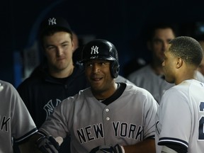 New York Yankees outfielder Vernon Wells is all smiles after hitting a home run off of Blue Jays reliever Brett Cecil at the Rogers Centre on Friday. (Stan Behal/Toronto Sun)