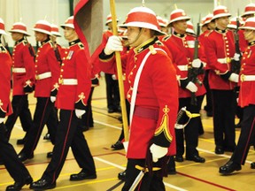 Capt. Jeff Castleton marches alongside fellow 3RCR soldiers in full ceremonial scarlet uniforms, flying a stand-in for the battalion colours during a rehearsal at Dundonald Hall, preparing for the 3RCR trip to Toronto on April 27, where they will be performing a demonstration at an event commemorating the Battle of York and receiving new colours.  For more community photos please visit our website photo gallery at www.thedailyobserver.ca.