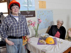 Construction was the theme of this year's Trinity United Church UCW Spring Tea Saturday afternoon. Greeter Bev Barber, left, got into the spirit of the event, as did Verna Blight and Mary Domes. The theme was chosen because the church's recreational space is under renovation.  (CLARISE KLASSEN/PORTAGE DAILY GRAPHIC/QMI AGENCY)