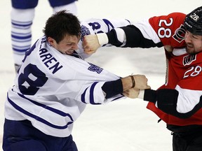 Ottawa Senators' Matt Kassian (28) fights Toronto Maple Leafs' Frazer McLaren (38) during a game last season. Darren Brown/Ottawa Sun