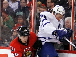 Ottawa Senator's Jean-Gabriel Pageau (44) checks Toronto Maple Leafs' Mikhail Grabovski (84) during second period of NHL hockey action at Scotiabank Place Saturday, April 20, 2013.  Darren Brown/Ottawa Sun/QMI Agency