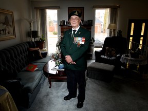 Korean War veteran William Harrison poses for a photo in his Edmonton home Friday April 19, 2013. Harrison will be in South Korea later this week to attend events surrounding the 60th anniversary of the Korean War Armistice. David Bloom/Edmonton Sun/QMI Agency