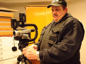 John McCormick, founder and lead investigator of Motor City Ghost Hunters, sets up his camera in the basement of the Lawrence House Centre for the Arts Saturday, April 20, 2013. Ghost hunters from as far away as Hamilton and Detroit turned out for a four-hour paranormal investigation. BARBARA SIMPSON / THE OBSERVER / QMI AGENCY