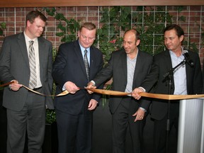 Minister of Infrastructure and Grande Prairie-Wapiti MLA Wayne Drysdale (centre, left) helps Rob Haberman (centre, right) part-owner of Points West Living cut the ribbon at the grand opening of Points West Living 10 new hospice beds for palliative care, Friday. Owen Lewis (left) from Grande Prairie Hospice Palliative Society and Lorenzo Clonfero, part owner of Points West Living, (right) also participated in the ribbon cutting. (Supplied)