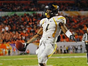 West Virginia Mountaineers wide receiver Tavon Austin makes it into John Kryk's top 10 offensive players in this year's NFL draft. (ANDREW INNERARITY/Reuters)