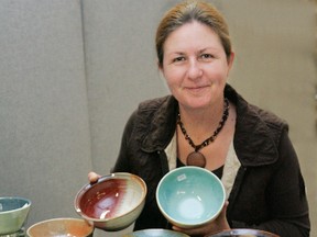 Expositor file photo

Cindy Snetsinger of the Brantford Potters' Guild is shown in a 2011 photo displaying some of the work created by the group's members.