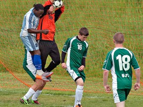 Expositor file photo

St. John's keeper Matteo DeCosmi, shown snagging the ball, will be a key player for the defending champion Green Eagles this season.