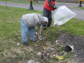 ERIKA GLASBERG/staff photo
Al Boyle, director of the Cornwall and District Horticultural Society and volunteer Steve Larin, clean the ditch by the St. Hubert restaurant during the City of Cornwall’s third annual Spring Clean-Up Challenge on Saturday. About 50 people participated in the challenge during the kickoff cleanup as part of an Earth Day initiative. Those wishing to participate can still do so until April 27 by visiting www.cornwall.ca.