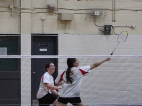 Stephanie Bethune of Chippewa Secondary School reaches up with her racket to return the shuttlecock back over the net while doubles partner Megan Ray watches. The Raiders team won the NOSSA junior's doubles title over Sarah Sherry and Bree Parfitt of Widdifield Secondary School on Saturday afternoon at École Secondaire Franco-Cite. Sherry and Parfitt won the NDA title over Bethune and Ray earlier in the week.