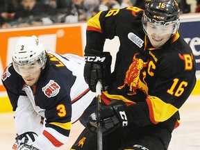 Belleville Bulls captain Brendan Gaunce battles for the puck during OHL playoff action Saturday night at Yardmen Arena. (Don Carr for The Intelligencer)