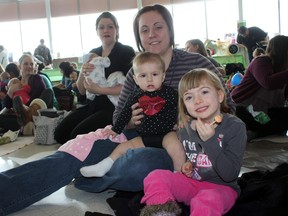 Close to 50 parents, most of them mothers, took part in the Great Cloth Diaper Change in Timmins on Saturday. The event was part of a worldwide effort at a Guinness World Record for most simultaneous cloth diaper changes. Mom Jessica Gagnon was among those learning of the benefits of cloth diapering. She was accompanied by her two daughters, seriously cute Mikaela, left, and enthusiastic helper Breuklen.
