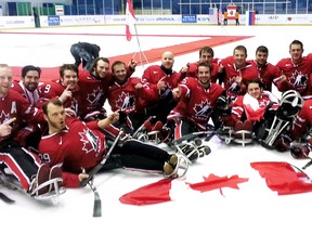 Canadian players celebrate their 1-0 win over the United States in the gold-medal game at the International Paralympic Committee world sledge hockey championship Saturday in Goyang, South Korea. Defenceman Derek Whitson of Chatham is in the back row, fifth from the right. Graeme Murray scored the winning goal in the second period and Corbin Watson posted the shutout as Canada earned its first world championship since 2008. (Hockey Canada Photo)