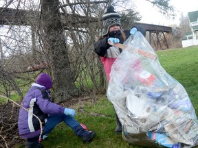 Gabby Ellis and Madison Scott help pick up trash in Trenton  during the Quinte area Trash Bash event Saturday. 
EMILY MOUNTNEY/TRENTONIAN/QMI AGENCY