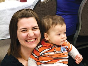 Cindl Nabb holds up her ten-month-old baby Brennan after changing his cloth diaper for the Great Cloth Diaper Change on Saturday, April 20 at the Best Western Lakeside Inn.
GRACE PROTOPAPAS/Daily Miner and News