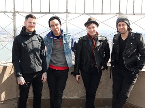 Fall Out Boy promote their new album Save Rock and Roll during a photocall on the Empire State Building's 86th floor observatory April 15, 2013. From left: Andy Hurley, Pete Wentz, Patrick Stump and Joe Trohman. (PNP/ WENN.com)