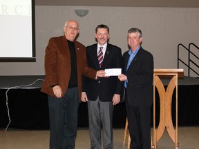 Whitecourt Mayor Trevor Thain is presented with a cheque for $210,000 from Finance Minister Doug Horner and MLA George VanderBurg to go towards uninsurable damages from the wind storm that hit Whitecourt on Aug. 4, 2012.
Johnna Ruocco | Whitecourt Star