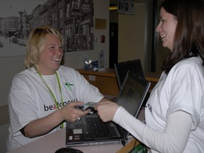 Hospital employee Tanya Schumacker checks to see if fellow employee Debra Schenk is registered as an organ donor.