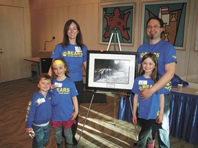 Echo Dawn Houle and husband Dan with children Draven, Autumn and Nevada, and her winning photo, which will be hung in the RVA offices at Edmonton city hall. Story on page 4.