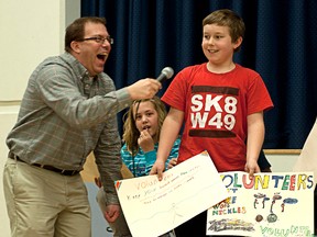 TAYLOR WEAVER HIGH RIVER TIMES
Tim Radmanovich of Mr. Baldwin’s grade four/five class at Spitzee Elementary School was one of many students to express their gratitude towards the many volunteers the school has to help make special events possible. The class used idioms to express how they felt and Radmanovich got a laugh out of Spitzee principal Kevin Newman and everyone in attendance that day.