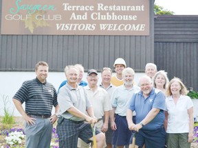 On day one (July 16, 2012) of renovations, front row (Left to right) Jeff Myatt, Paul Zorzi, Tim Eaton and Carol McDermid, second row: Ken Dunlop, Richard Ferguson, Joel Parr and Sandy Prange, back row: Jamie Hastings and Garry Walker, all stand in front of the 1967 Terrace restaurant and clubhouse in honour of all the great memories shared at the facility.