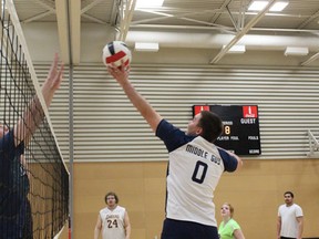 Matthew Yarnton drives the volleyball over the net during co-ed recreational volleyball at Swartout Hall in the Kerry Vickar Centre on Sunday, April 21.