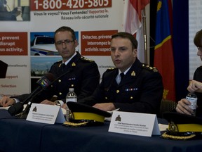 A joint-unit police task force "Project Smooth" lead by the RCMP has foiled an alleged al-Qaeda backed terrorist plot - originating from Iran - to derail a VIA Rail passenger train thats route was from New York to Toronto and murder unknown citizens. Two men Chiheb Esseghaier, 30 of Montreal and Rael Jaser, 35, of Toronto have been arrested. (Pictured, L-R ) RCMP Chief Supt.  Gaétan Courchesne, Asst. Commissioner James Malizia, Chief Supt. Jennifer Strachan prepare for the presser about the two alleged terror suspects. (Jack Boland / Toronto Sun / QMI Agency)